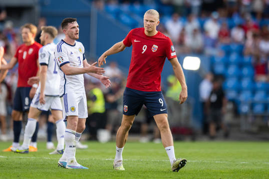 Andrew Robertson of Scotland and Erling Braut Haaland of