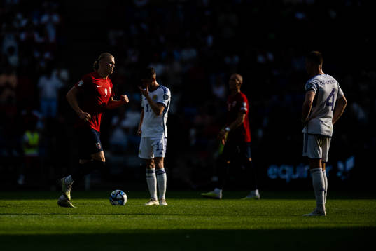 Erling Braut Haaland of Norway and Ryan Christie and Scott