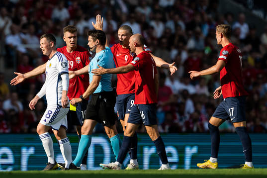 Alexander Sørloth and Erling Braut Haaland of Norway argue