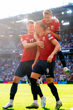 Erling Braut Haaland of Norway celebrates with teammates