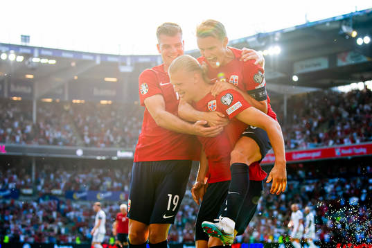 Erling Braut Haaland of Norway celebrates with teammates