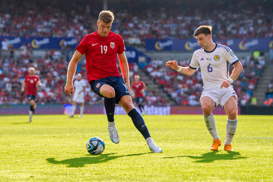 Alexander Sørloth of Norway and Kieran Tierney of Scotland