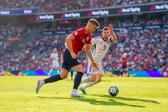 Alexander Sørloth of Norway and Andrew Robertson of