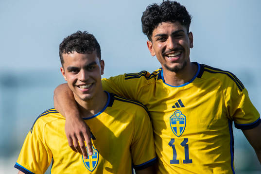 Yasin Ayari and Ahmed Qasem of Sweden celebrate