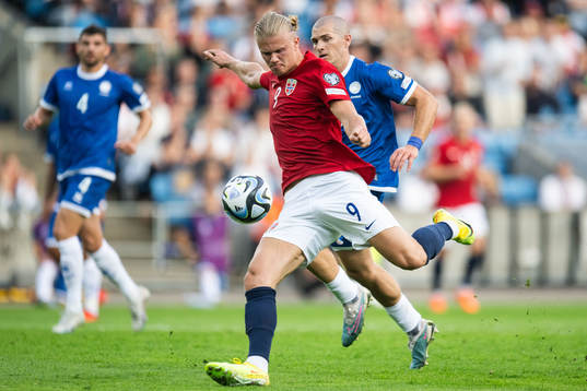 Erling Braut Haaland of Norway and Alexander Gogic of Cyprus