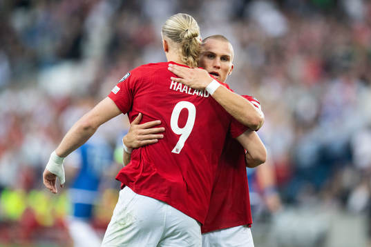 Erling Braut Haaland of Norway celebrates with Leo Skiri