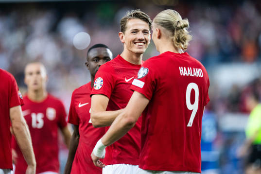 Erling Braut Haaland of Norway celebrates with Sander Berge