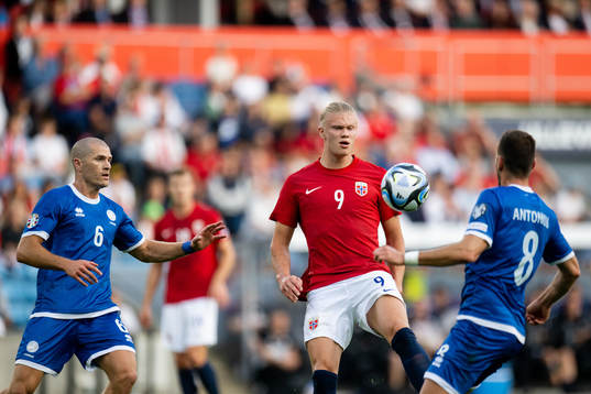 Alexander Gogic of Cyprus and Erling Braut Haaland of Norway