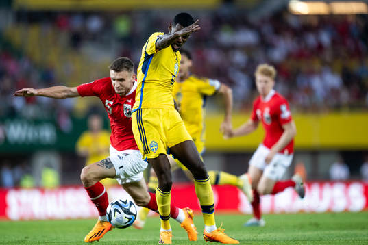 Stefan Posch of Austria and Alexander Isak of Sweden