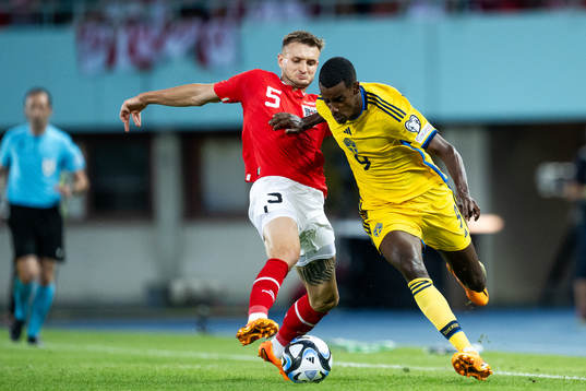 Stefan Posch of Austria and Alexander Isak of Sweden