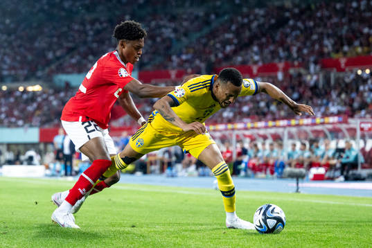Junior Adamu of Austria and Martin Olsson of Sweden