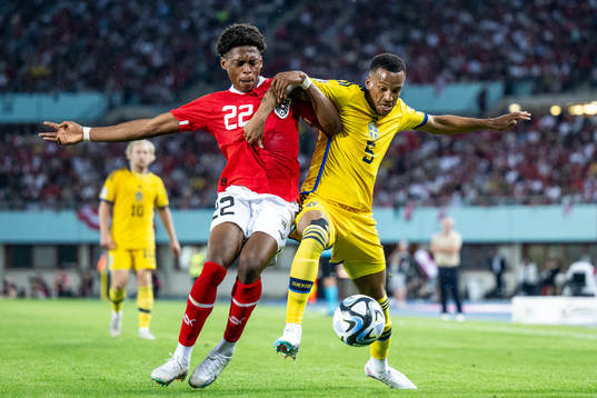 Junior Adamu of Austria and Martin Olsson of Sweden