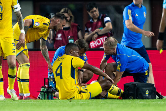 Isak Hien of Sweden receives medical attention