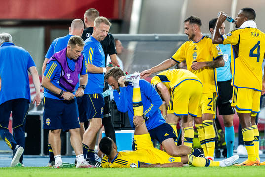 Martin Olsson of Sweden recieves medical attention