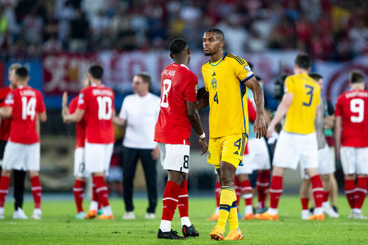 David Alaba of Austria and Isak Hien of Sweden