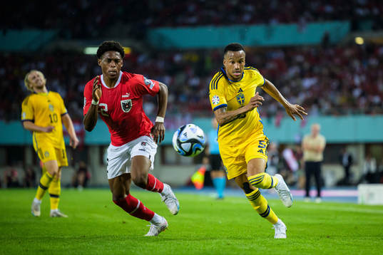 Junior Adamu of Austria and Martin Olsson of Sweden