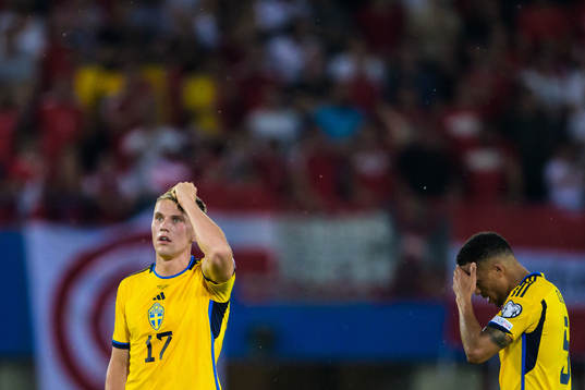Viktor Gyökeres and Martin Olsson of Sweden look dejected