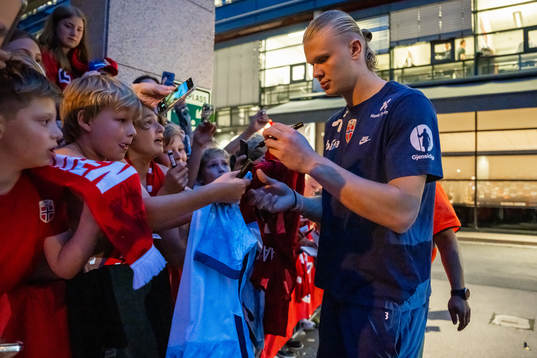 Erling Braut Haaland of Norway signs autographs