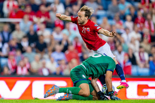 Bård Finne of Norway and goalkeeper Joel Mall of Cyprus