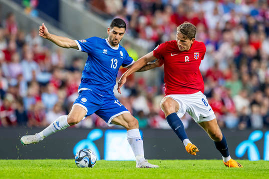 Ioannis Kousoulos of Cyprus and Sander Berge of Norway