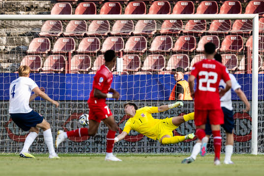 Dan Ndoye of Switzerland scores 1-1 behind goalkeeper Mads