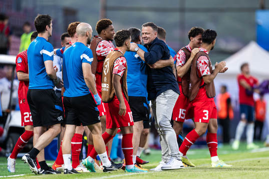 Head coach Patrick Rahmen of Switzerland celebrates