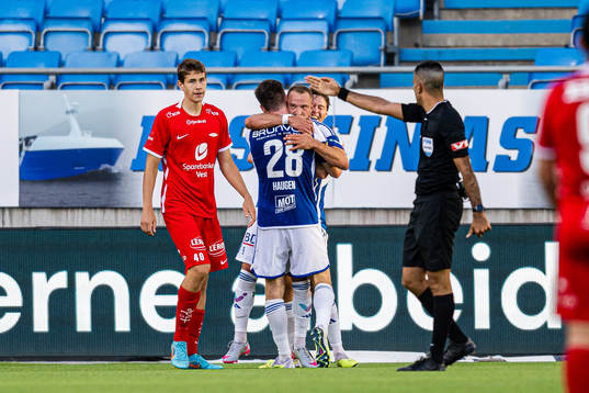 Eivind Fauske Helland of Brann looks dejected while Veton