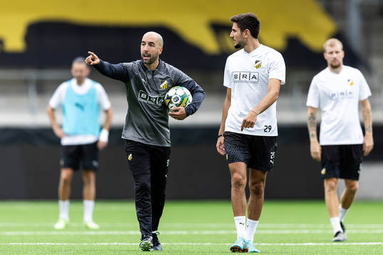 Assistant coach Martin Foyston and Filip Trpcevski of