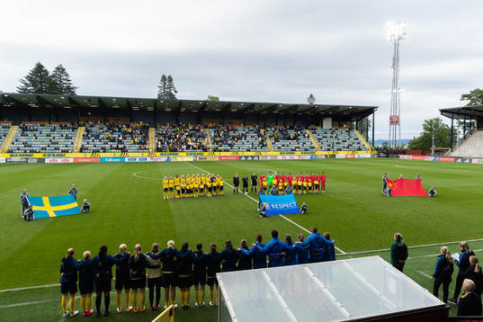 The teams stand