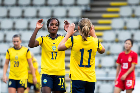Evelyn Ijeh and Paulina Nyström of Sweden celebrate