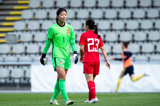 Goalkeeper Liu Chen of China looks dejected
