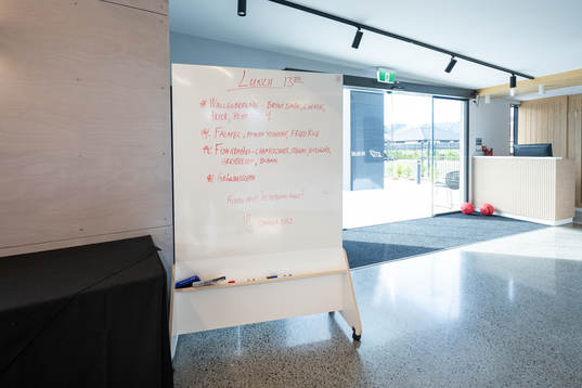 A white board which shows lunch dishes