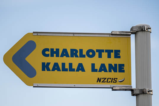 A road sign which reads ”Charlotte Kalla Lane” (named