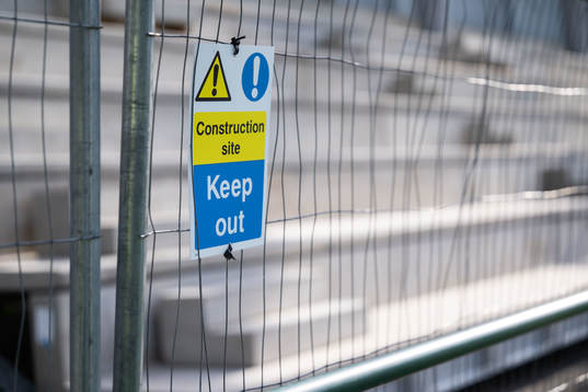 A construction site sign at Park Hall Stadium