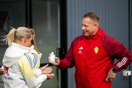 Head of Security Stefan Dejemyr hands a bottle of hand