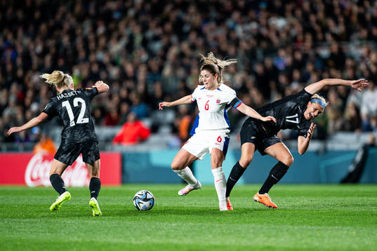 Betsy Hassett and Hannah Wilkinson of New Zealand against