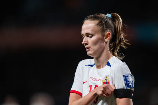 Caroline Graham Hansen of Norway pulls the black arm band,