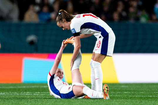 Thea Bjelde of Norway in pain and Caroline Graham Hansen of
