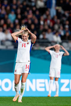 Ada Hegerberg and Caroline Graham Hansen of Norway react