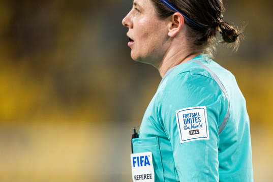 A badge with the text ”Football Unites the World”