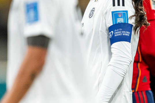 Katherine Alvarado with an armband with a text that reads