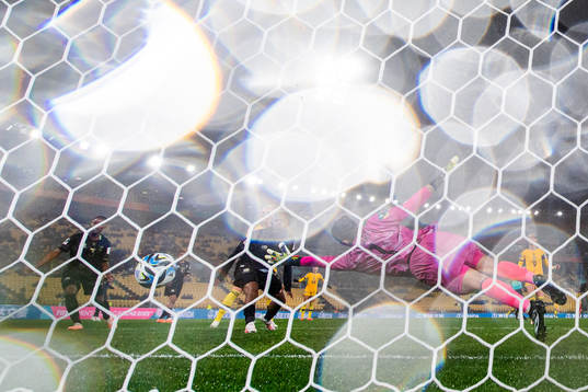 Fridolina Rolfö of Sweden scores 1-1 behind goalkeeper