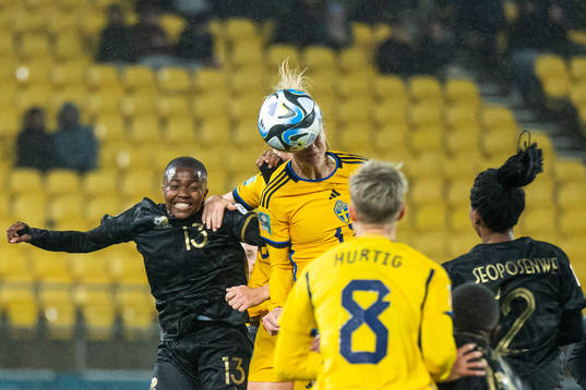 Bambanani Mbane of South Africa competes for the ball with