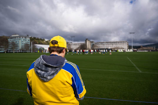 A fan watches players of the Swedish women’s national