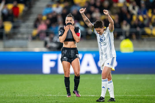 Ali Riley of New Zealand looks dejected while Tahnai Annis