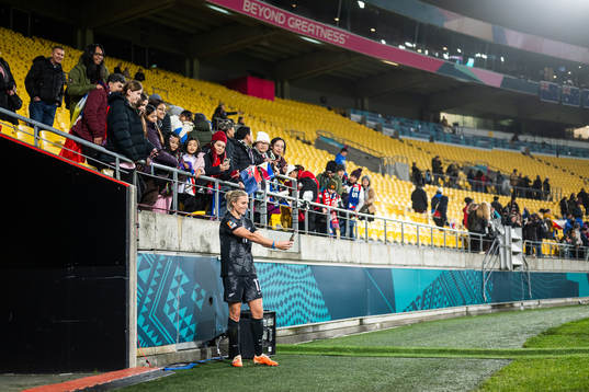 Hannah Wilkinson of New Zealand takes pictures with