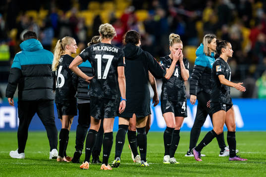 CJ Bott and Ali Riley of New Zealand look dejected