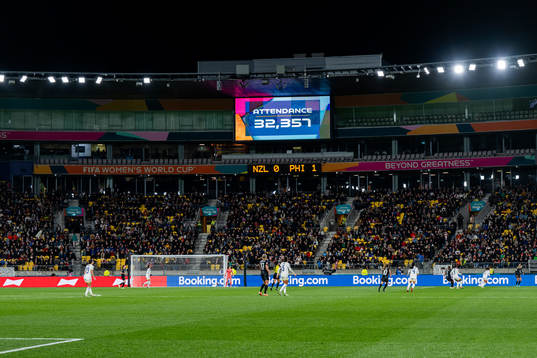 A screen shows the attendance of 32 357