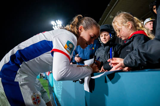 Guro Reiten of Norway signs autographs
