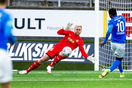 Goalkeeper Peter Abrahamsson of BK Häcken and Luc Kassi of